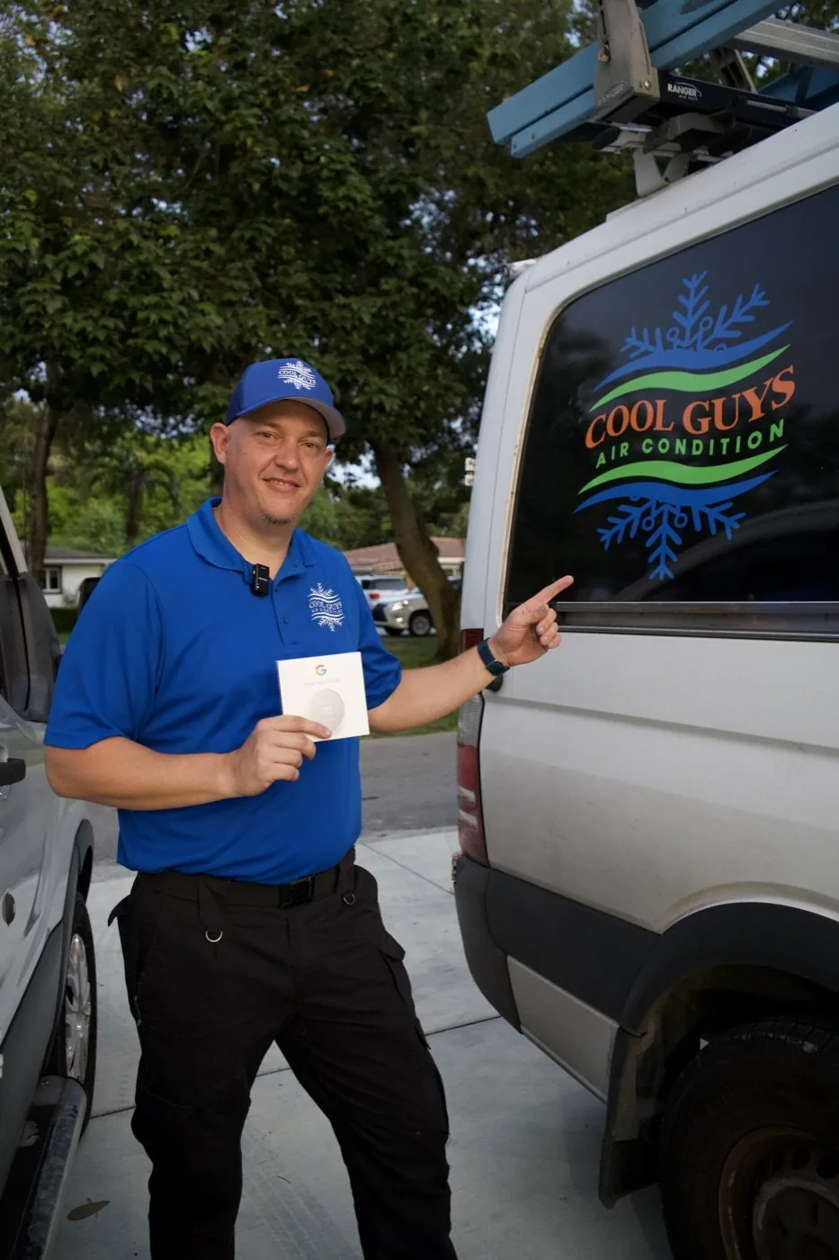 Cool Guys Air Condition technician showing the wrapped company van during an Optic Vault film day in Miami